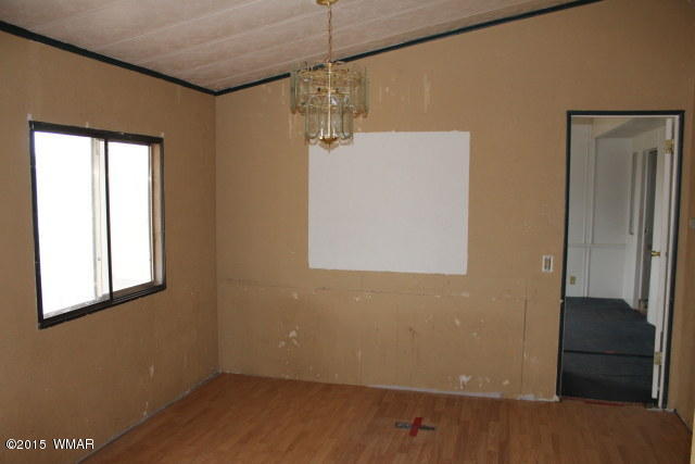 895 South Tanner Lane Snowflake, AZ 85937 - Photo 16 of 32 a view of a small space with wooden floor and a window