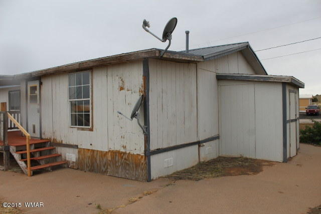 895 South Tanner Lane Snowflake, AZ 85937 - Photo 4 of 32 a backyard of a house with barbeque oven and iron