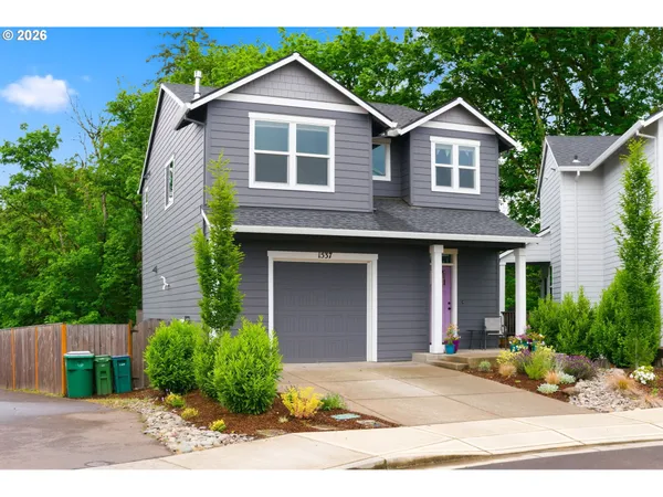a front view of a house with garden