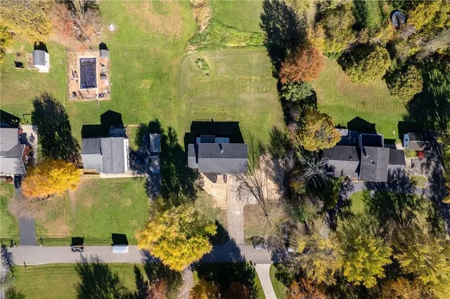 an aerial view of a residential apartment building with a yard