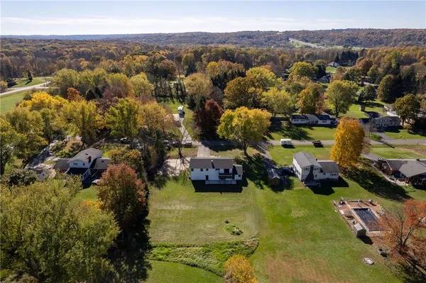 a swimming pool with some trees in the background