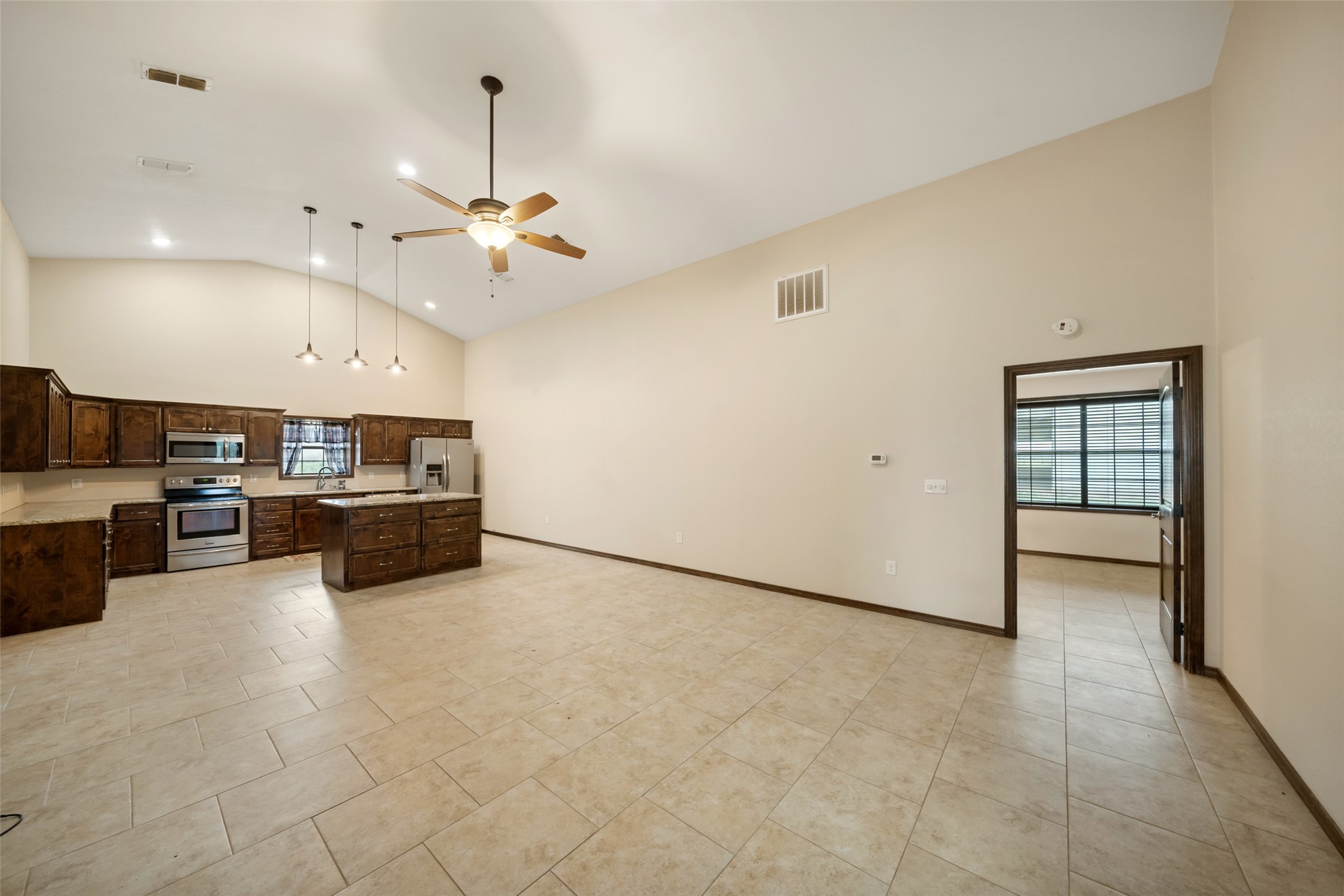 119 Fm 1891 Shiner, TX 77984 - Photo 26 of 40 a view of a kitchen with a sink and a refrigerator