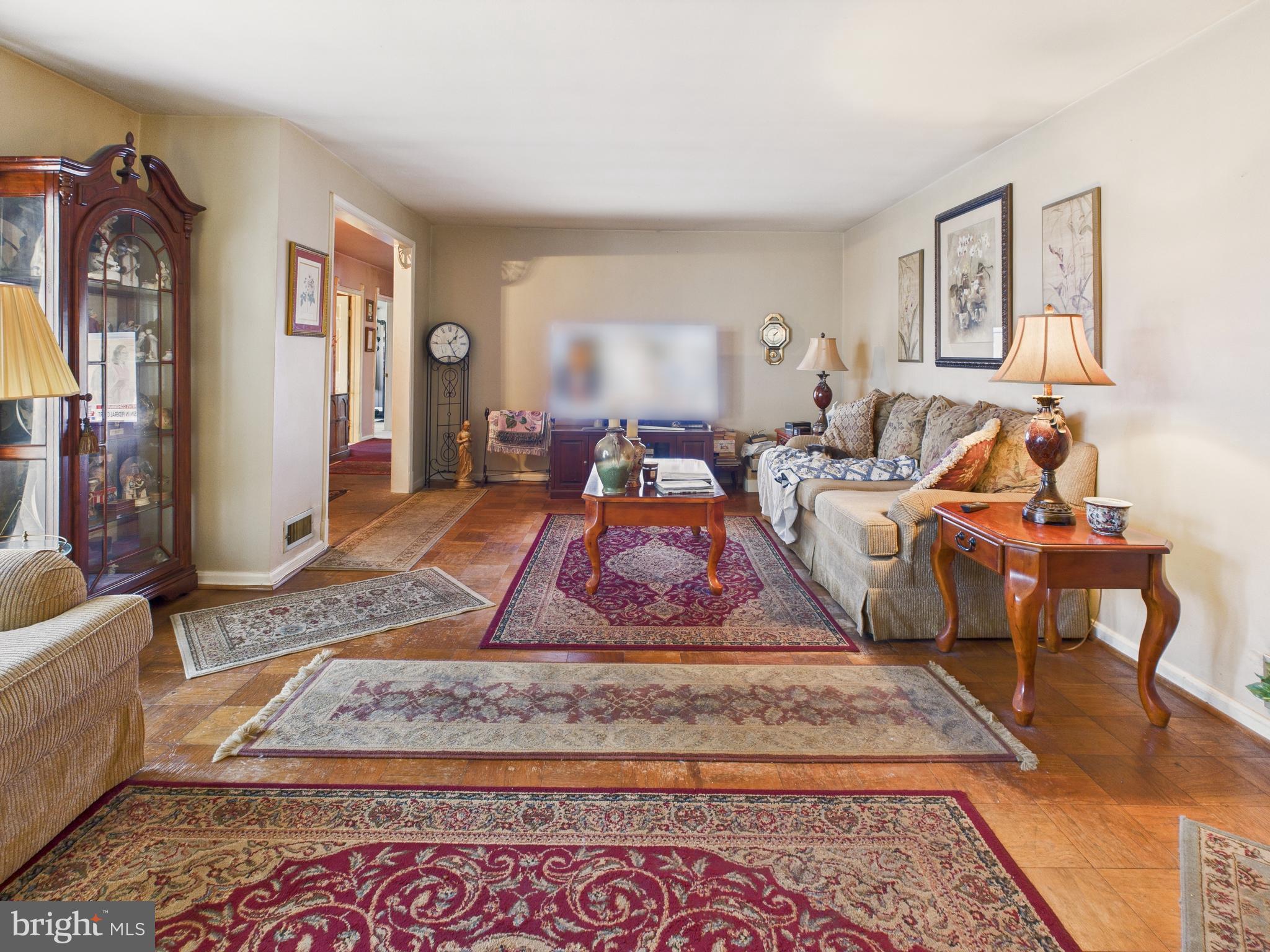 8005 Windsor Mill Road Baltimore, MD 21244 - Photo 11 of 39 a room with lots of furniture and a rug