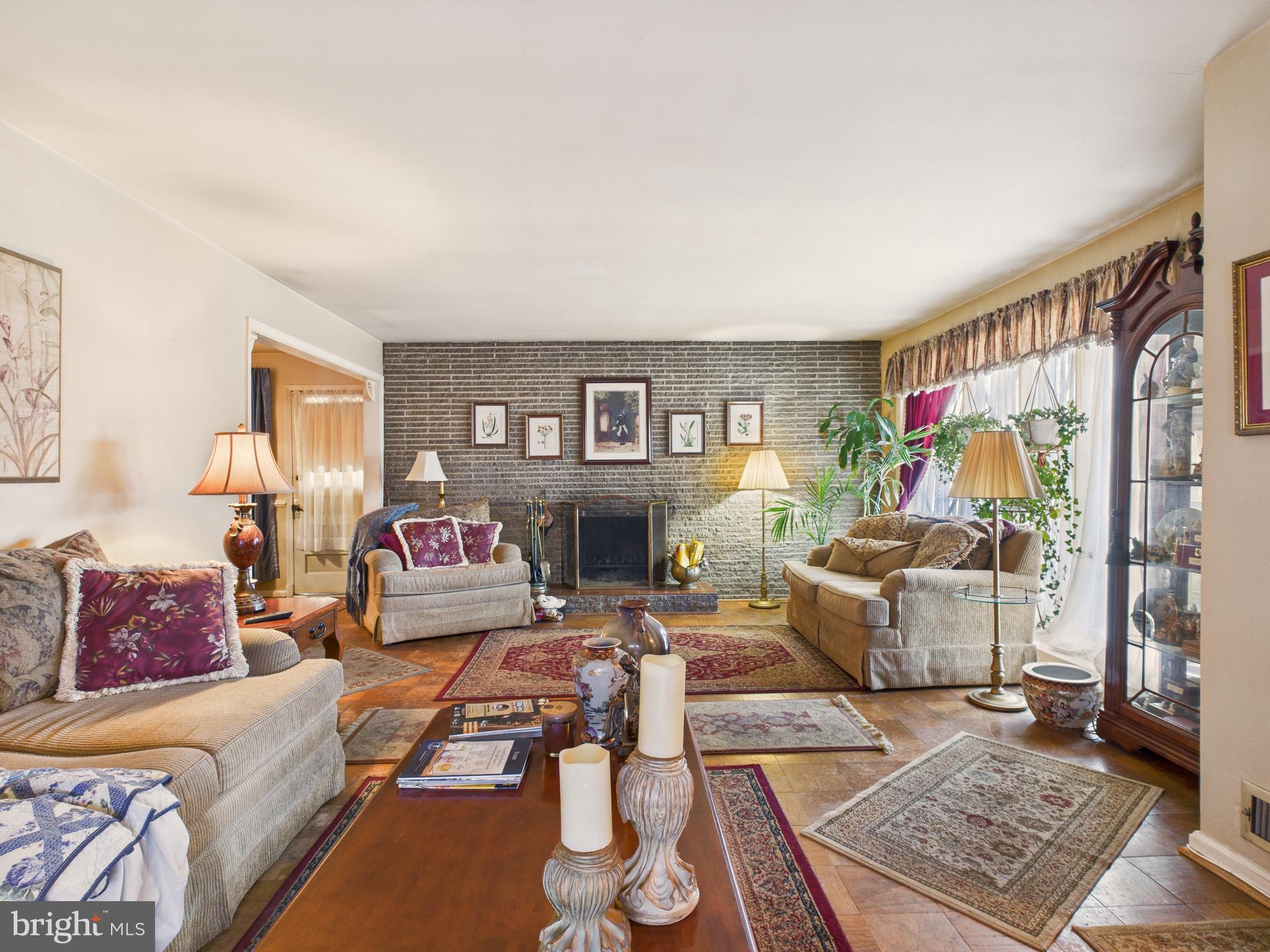 8005 Windsor Mill Road Baltimore, MD 21244 - Photo 13 of 39 a living room with furniture and a fireplace