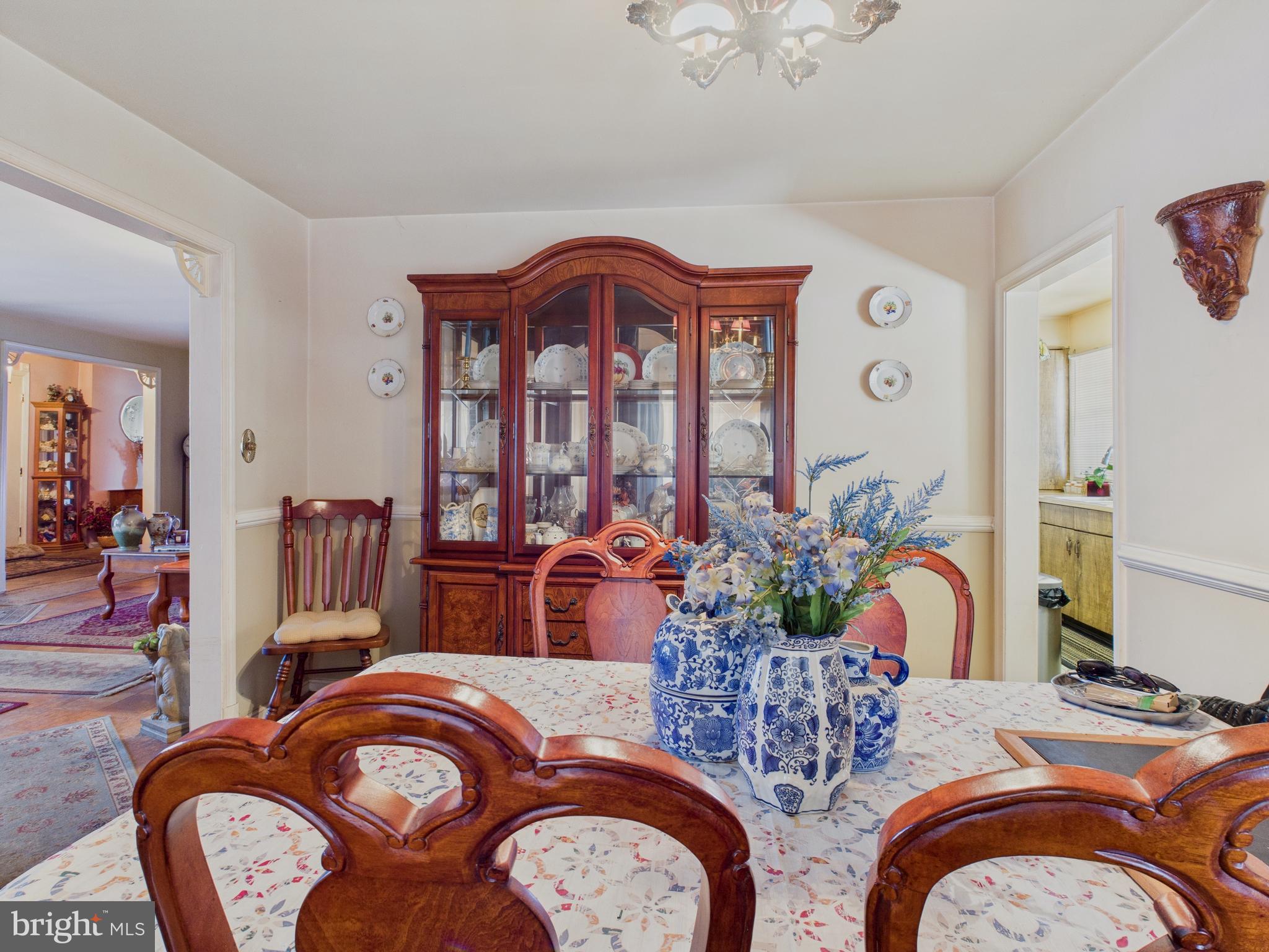 8005 Windsor Mill Road Baltimore, MD 21244 - Photo 16 of 39 a bedroom with two beds and a chandelier