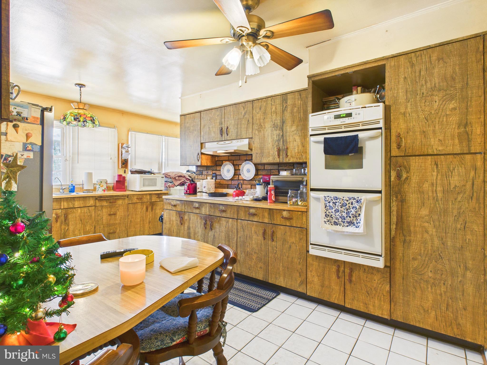 8005 Windsor Mill Road Baltimore, MD 21244 - Photo 18 of 39 a kitchen with a sink appliances and cabinets