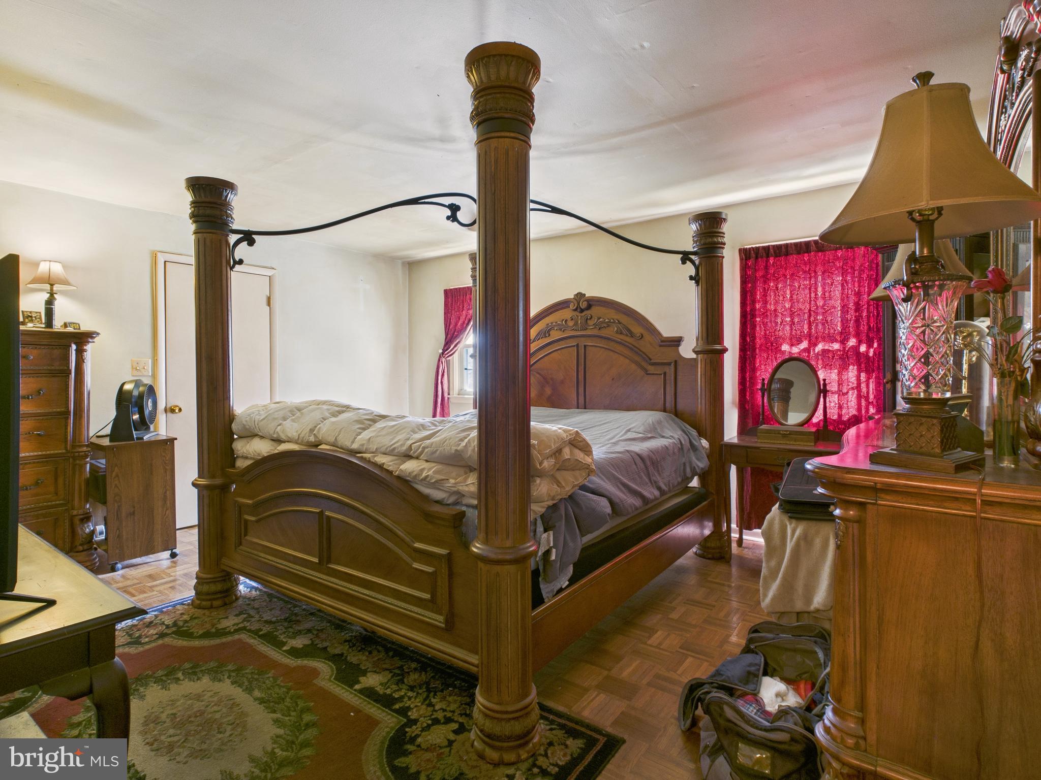 8005 Windsor Mill Road Baltimore, MD 21244 - Photo 20 of 39 a bedroom with bed and a window