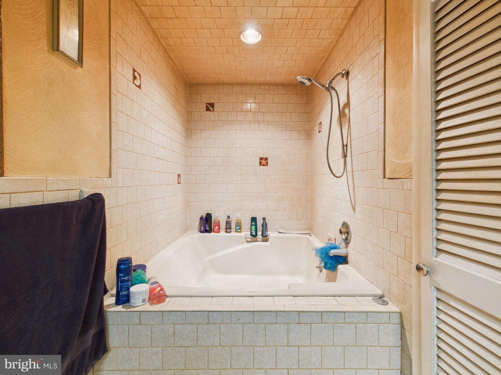 8005 Windsor Mill Road Baltimore, MD 21244 - Photo 22 of 39 a bathroom with a sink and a mirror