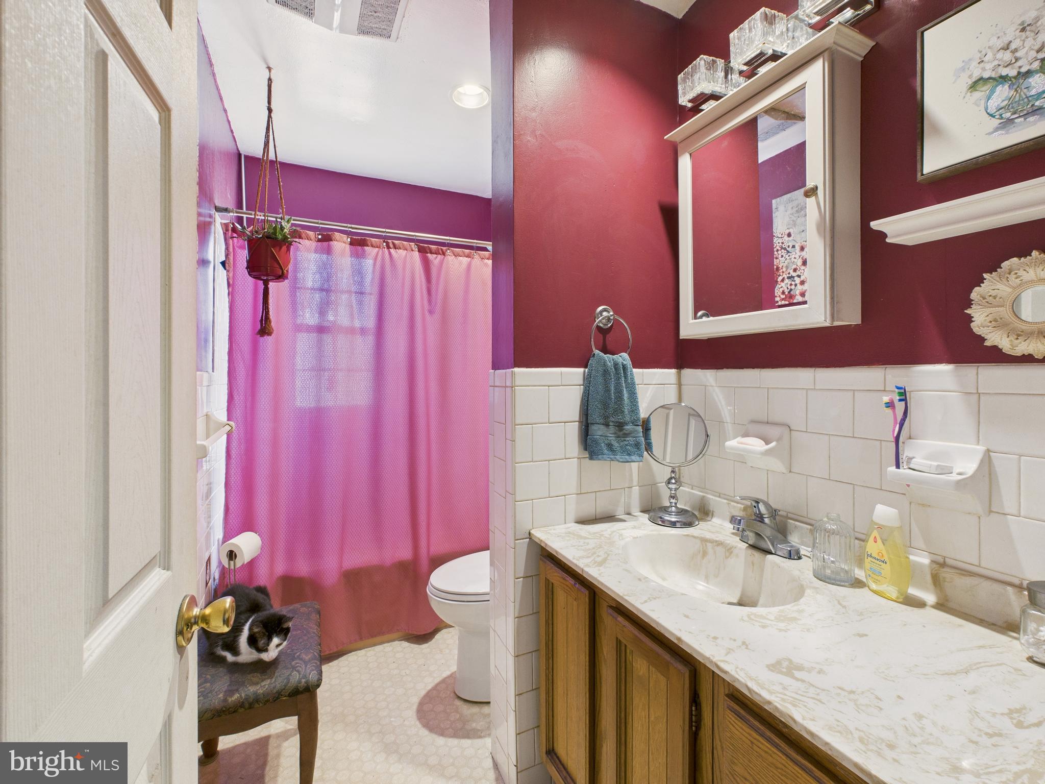 8005 Windsor Mill Road Baltimore, MD 21244 - Photo 25 of 39 a bathroom with a sink toilet and shower