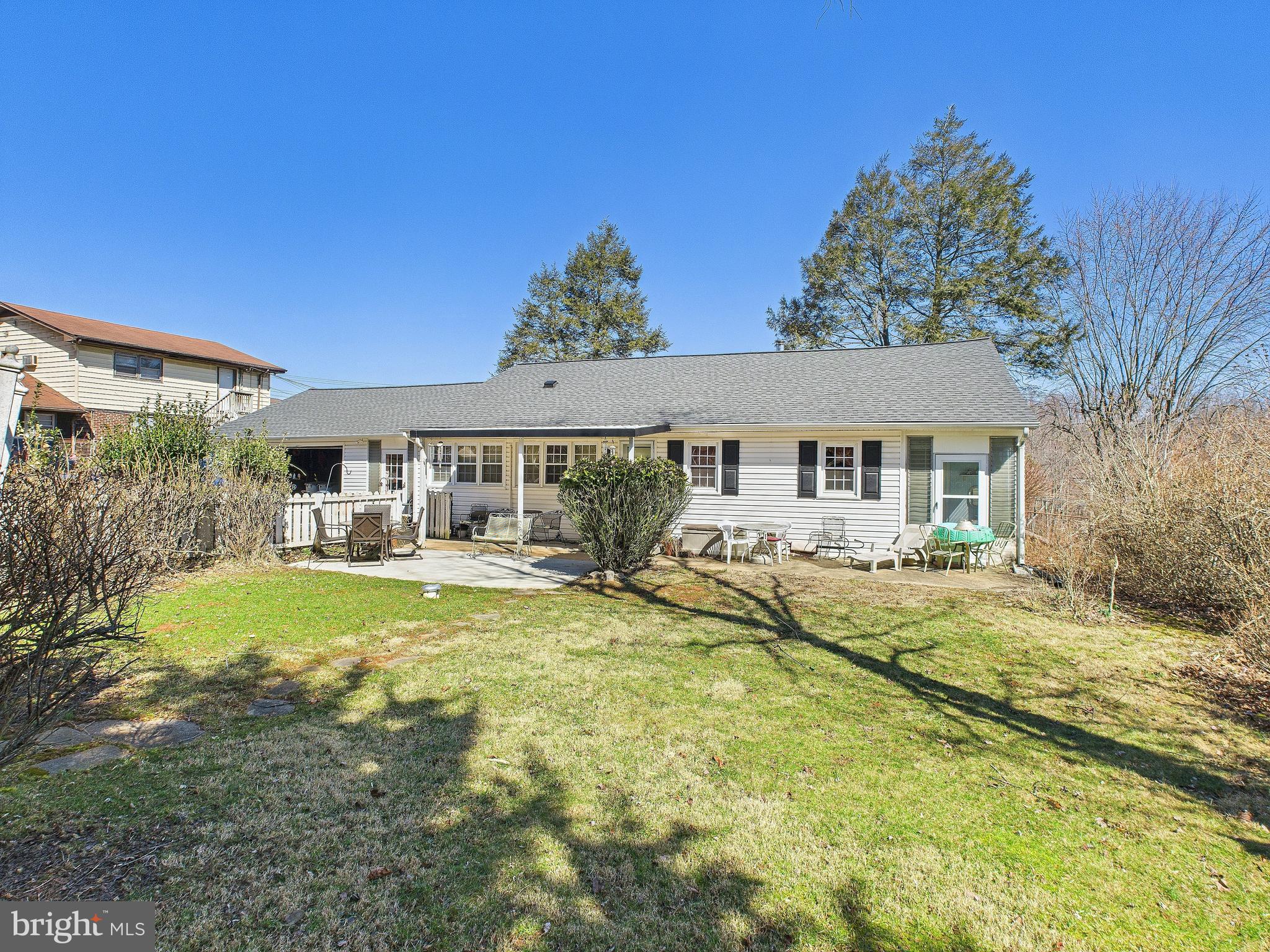 8005 Windsor Mill Road Baltimore, MD 21244 - Photo 31 of 39 a front view of a house with swimming pool having outdoor seating