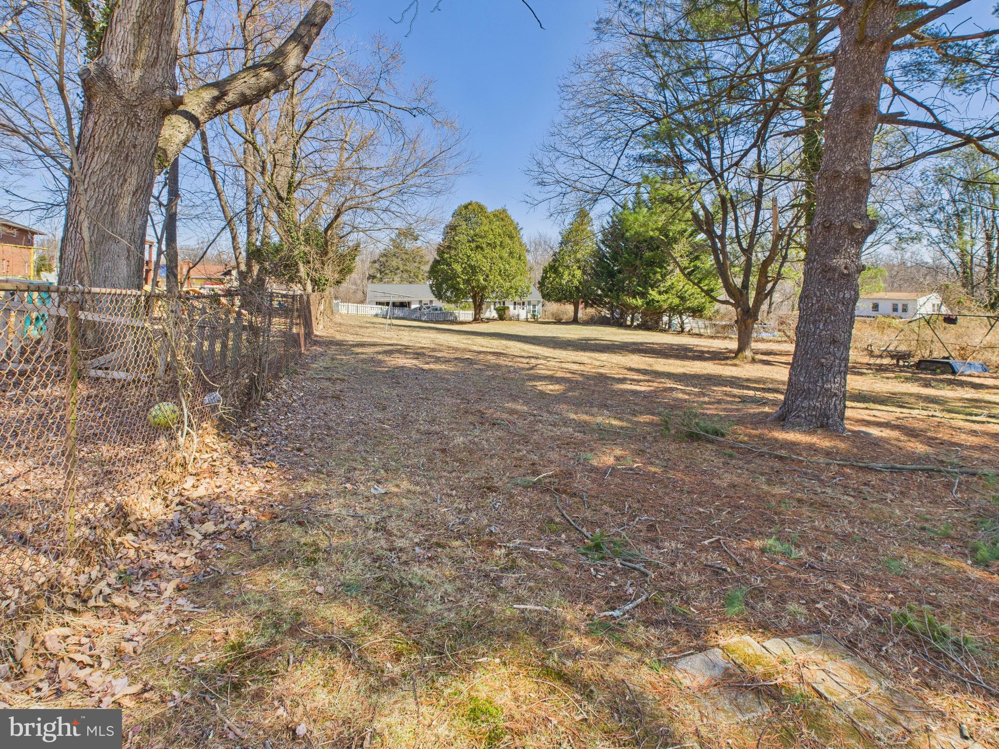 8005 Windsor Mill Road Baltimore, MD 21244 - Photo 36 of 39 a view of road with large trees
