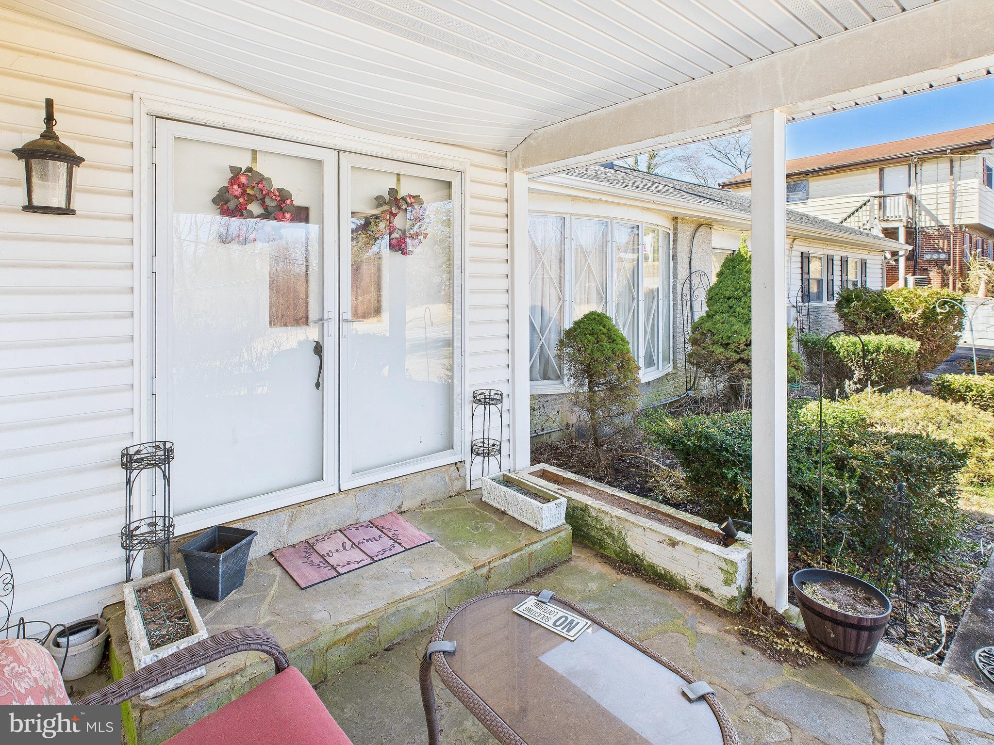 8005 Windsor Mill Road Baltimore, MD 21244 - Photo 7 of 39 a living room with furniture and a floor to ceiling window