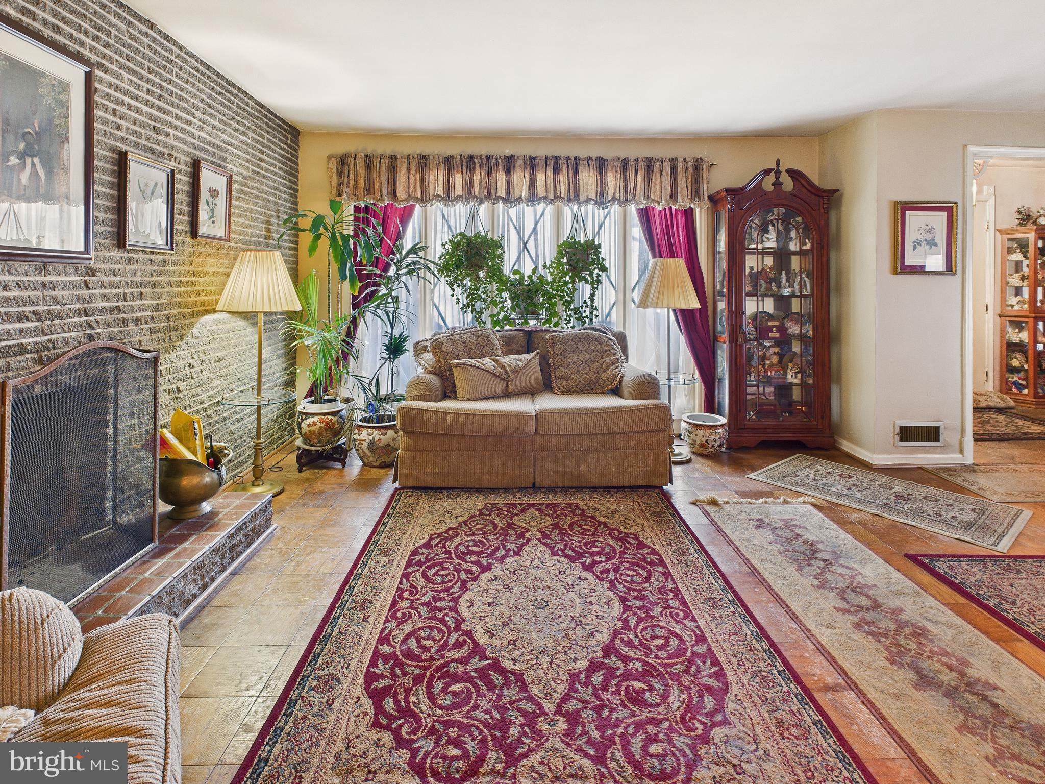 8005 Windsor Mill Road Baltimore, MD 21244 - Photo 10 of 39 a living room with furniture and a rug