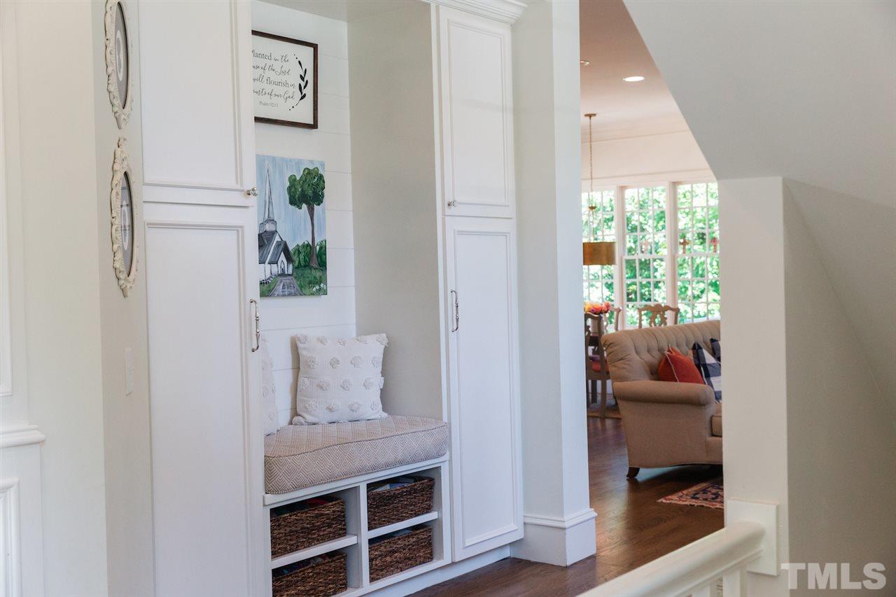 2620 Davis Street Raleigh, NC 27608 - Photo 15 of 28 Built in seat with cubbies and great space for storage in custom cabinets.