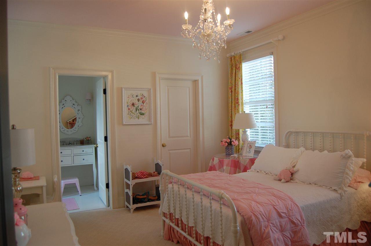 2620 Davis Street Raleigh, NC 27608 - Photo 25 of 28 Bedroom complete with custom bookshelves and window seat, and full bathroom.