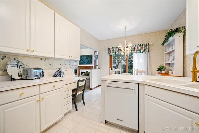 a dining room with furniture and a view of kitchen