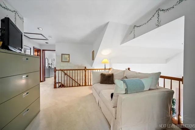 a patio with a table and chairs under an umbrella