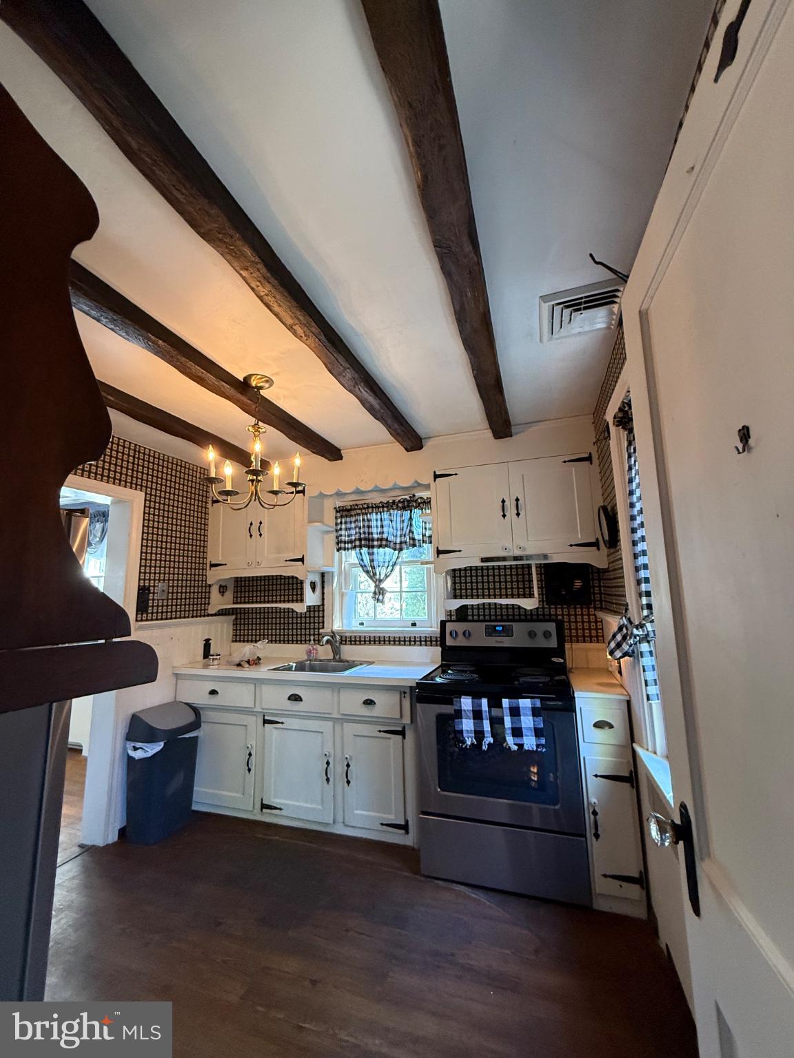 111 South Norwinden Drive Springfield, PA 19064 - Photo 2 of 13 Charming kitchen with rustic beams.