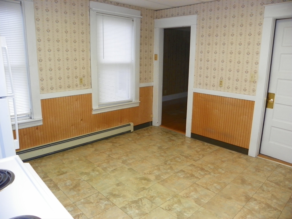 19 Franklin Court, Unit 1R Gardner, MA 01440 - Photo 2 of 8 an empty room with windows