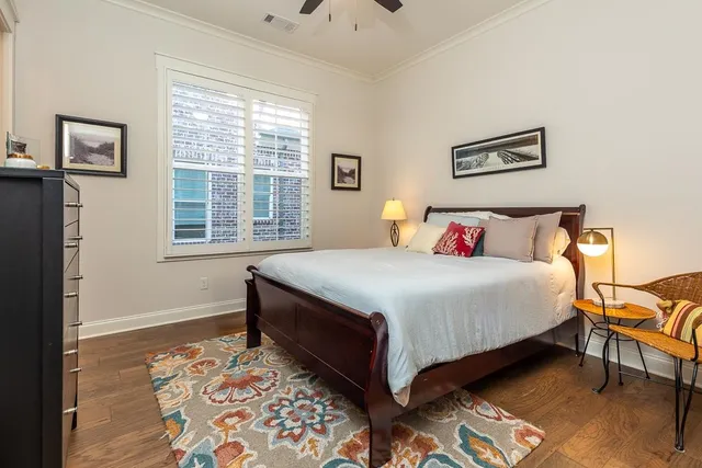 a bedroom with bed and a window