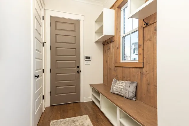 a view of a bedroom with a bed and a window