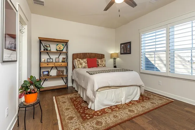 a bed room with a bed and a chandelier