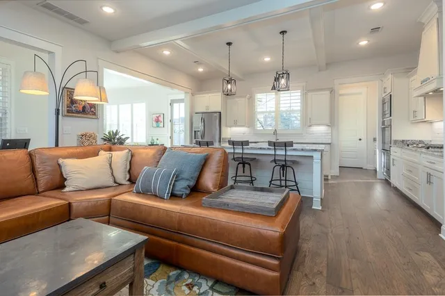 a living room with furniture fireplace and flat screen tv