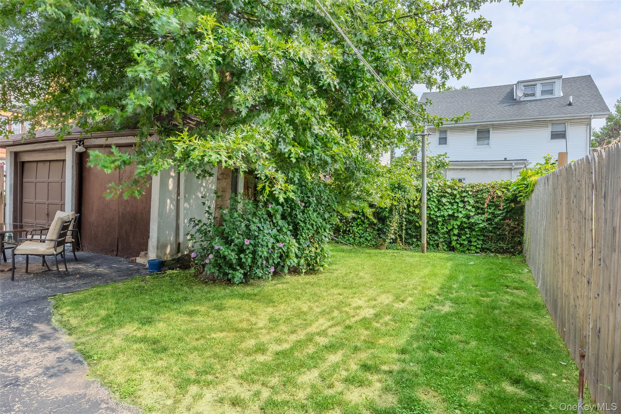 42-15 204th Street Queens, NY 11361 - Photo 22 of 23 a view of a yard in front of house