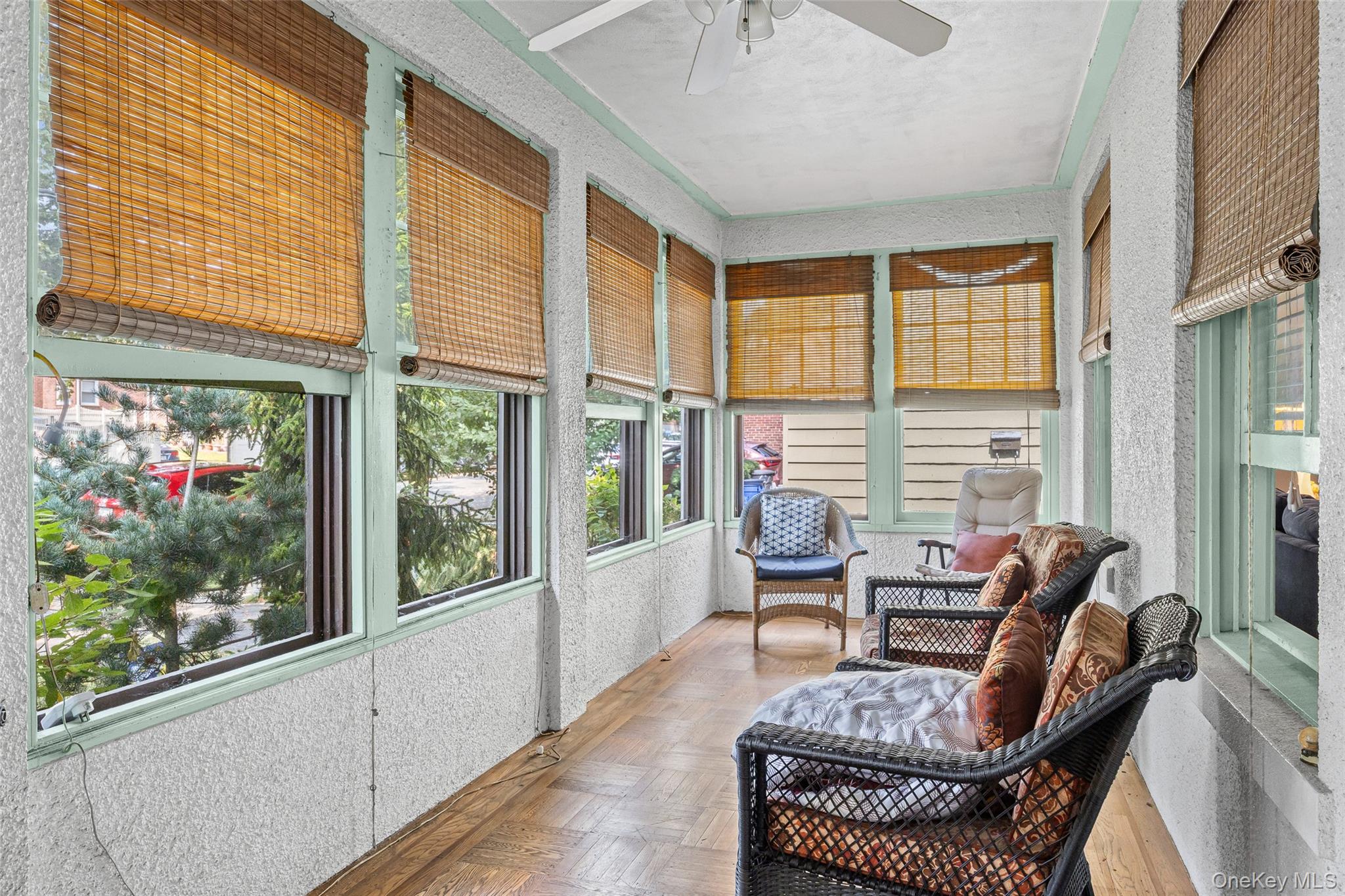42-15 204th Street Queens, NY 11361 - Photo 3 of 23 a living room with furniture and a floor to ceiling window