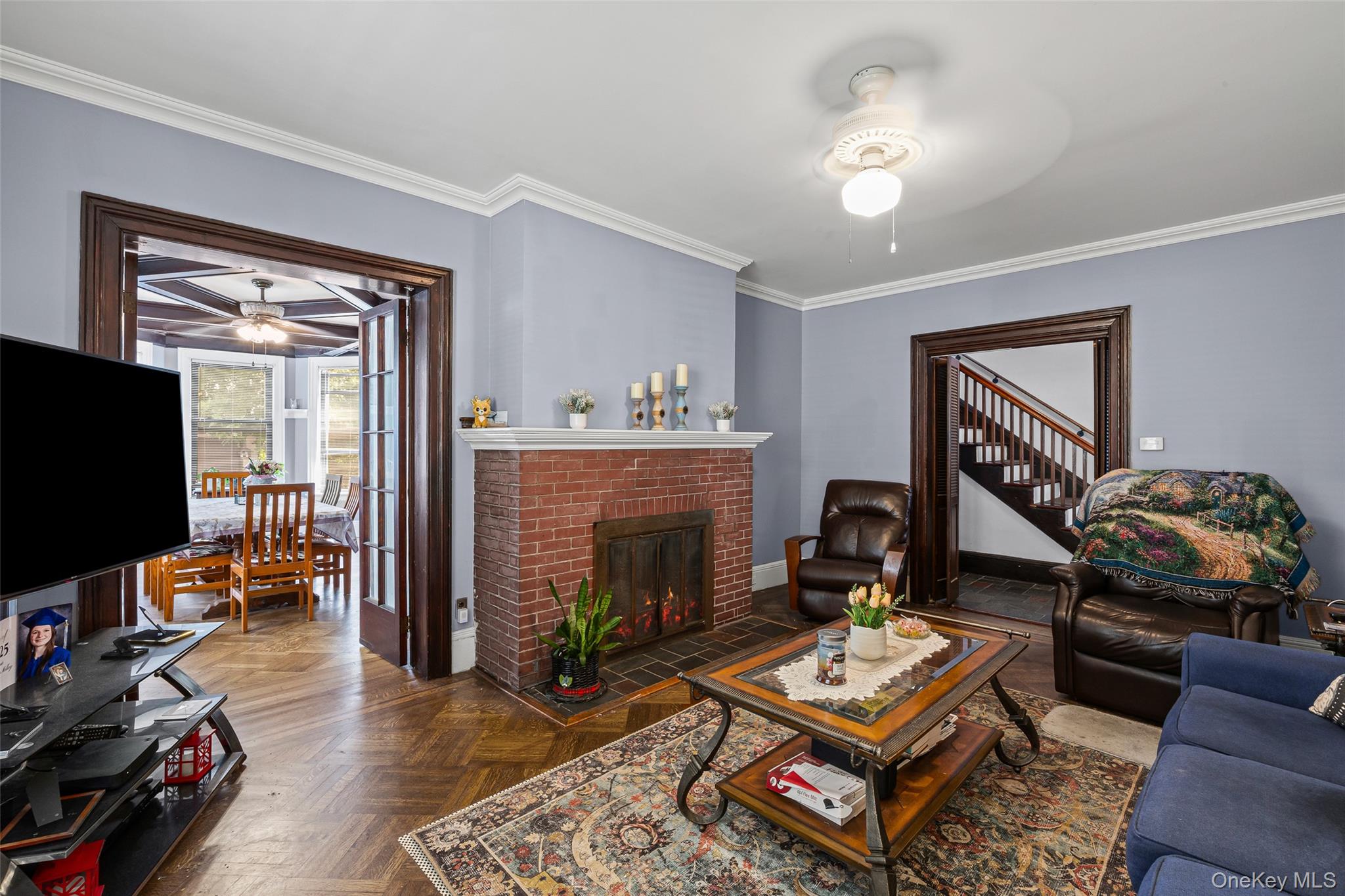 42-15 204th Street Queens, NY 11361 - Photo 6 of 23 a living room with furniture and a flat screen tv