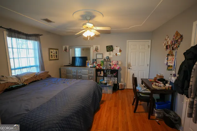 a bed room with a bed and a chandelier
