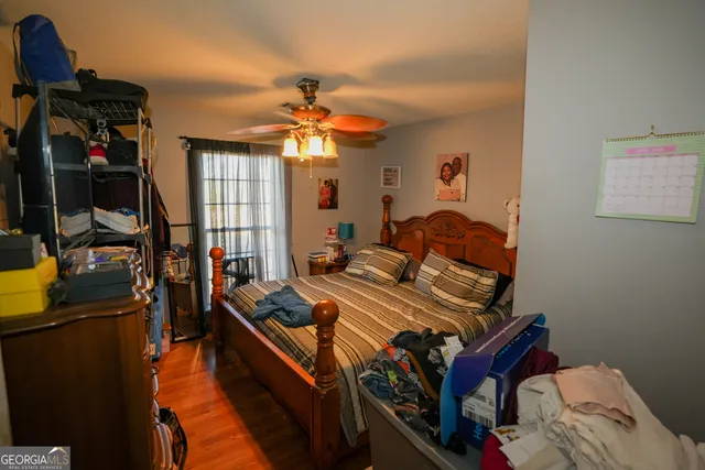 a bedroom with furniture and a window