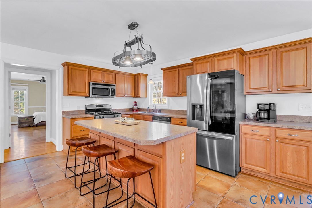 43 Ruddy Duck Road Heathsville, VA 22473 - Photo 8 of 46 a kitchen with stainless steel appliances granite countertop a sink a stove and cabinets