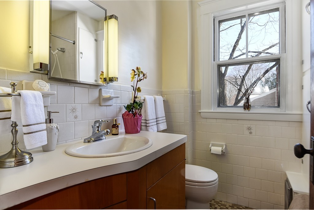80 Spring Road Needham, MA 02494 - Photo 15 of 25 a bathroom with a sink and a toilet