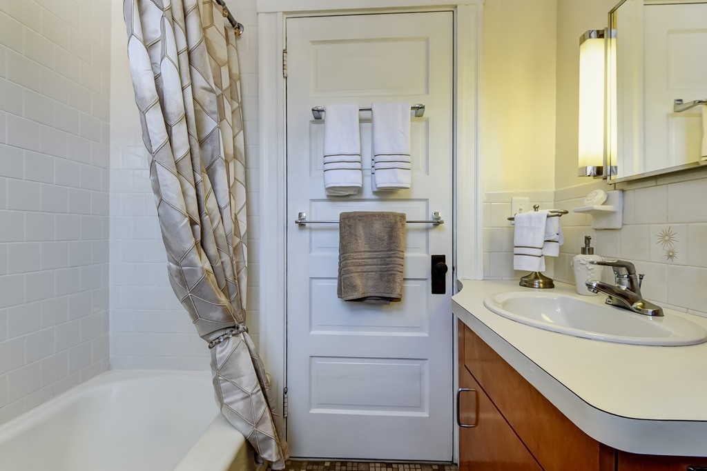 80 Spring Road Needham, MA 02494 - Photo 16 of 25 a bathroom with a sink a toilet and shower