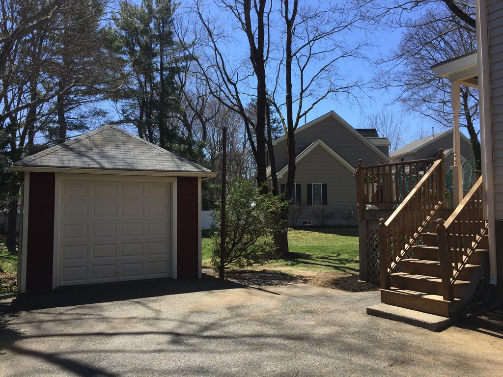 80 Spring Road Needham, MA 02494 - Photo 22 of 25 a house that has a tree in front of the house