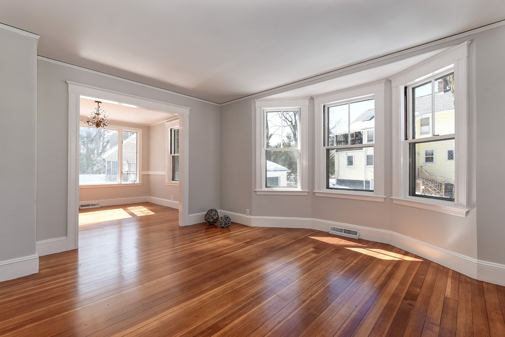 80 Spring Road Needham, MA 02494 - Photo 7 of 25 an empty room with wooden floor and windows