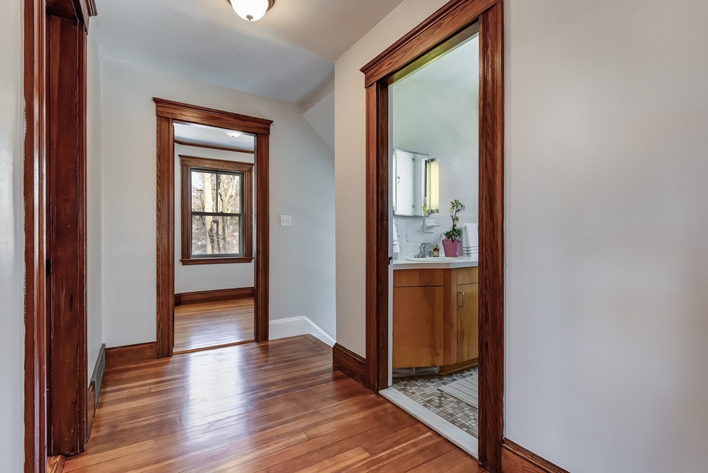 80 Spring Road Needham, MA 02494 - Photo 10 of 25 a view of a hallway view with wooden floor and staircase