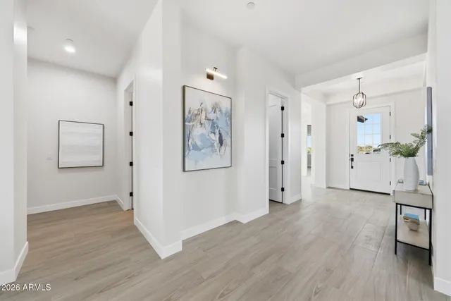 a bathroom with a bathtub shower sink vanity and toilet
