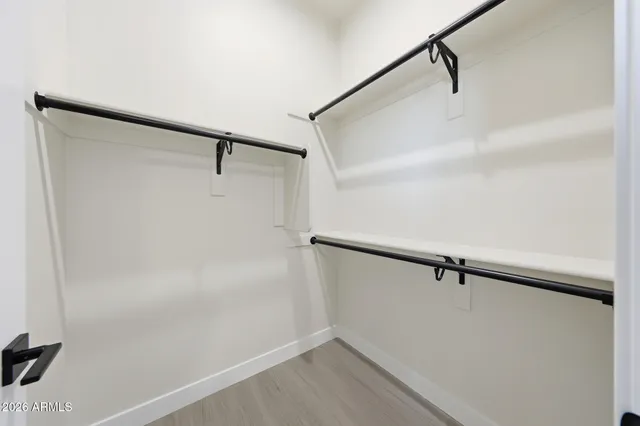 a bathroom with a double vanity sink mirror and toilet