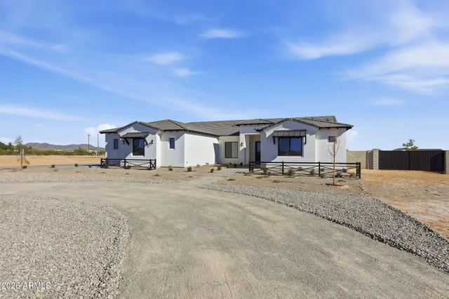 a large white kitchen with lots of counter top space