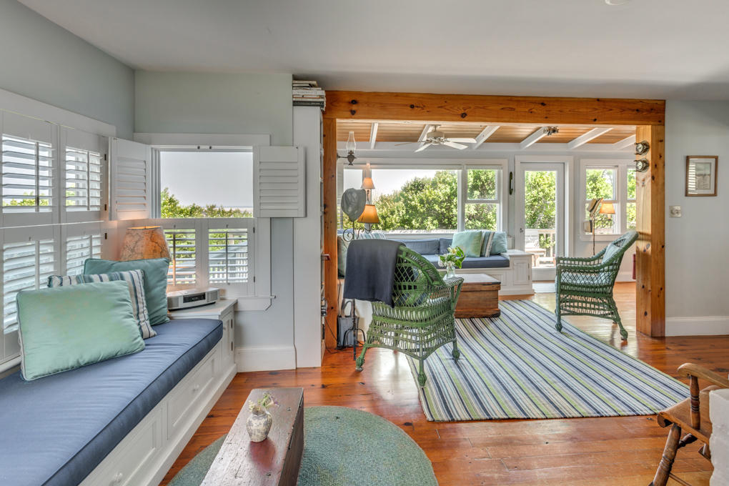 240 Robbins Hill Road Brewster, MA 02631 - Photo 11 of 35 a living room with furniture and a large window