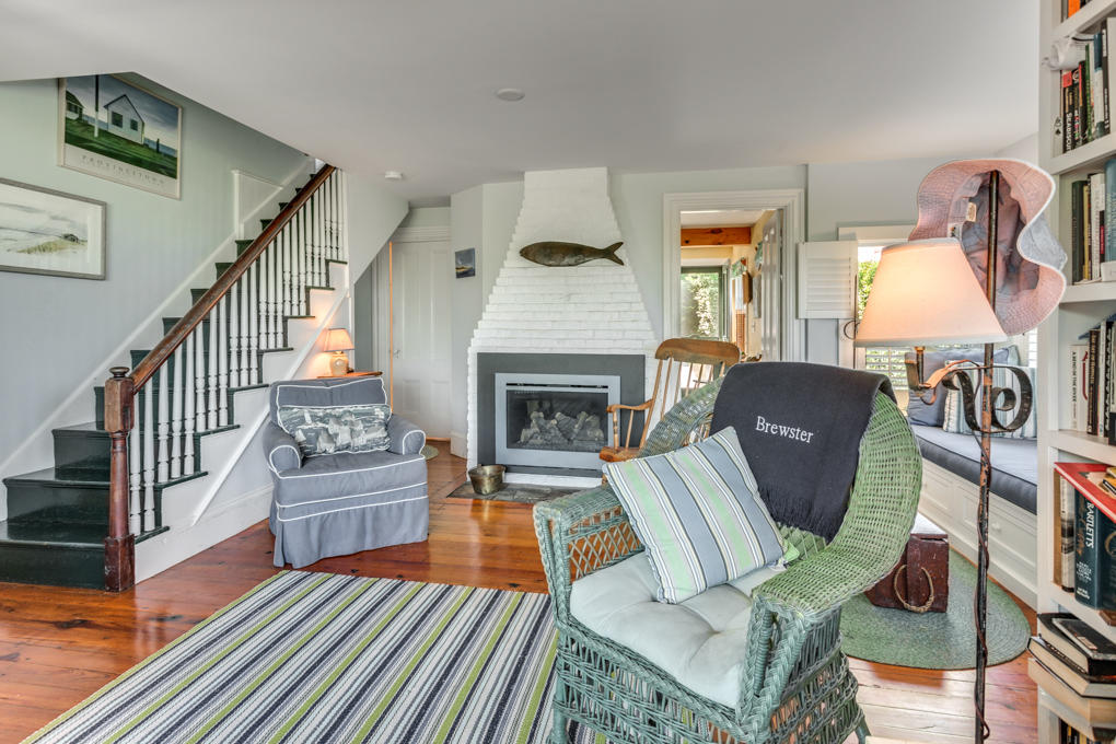 240 Robbins Hill Road Brewster, MA 02631 - Photo 14 of 35 a living room with furniture and a fireplace
