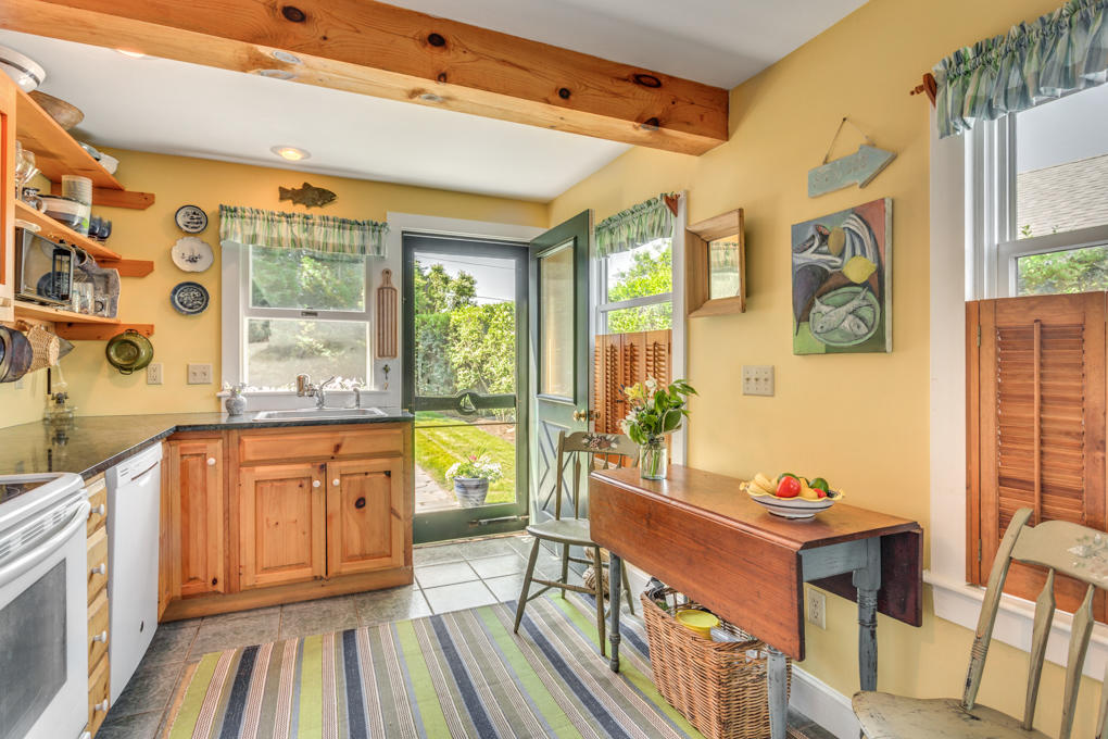 240 Robbins Hill Road Brewster, MA 02631 - Photo 15 of 35 a living room with stainless steel appliances granite countertop furniture and a wooden floor