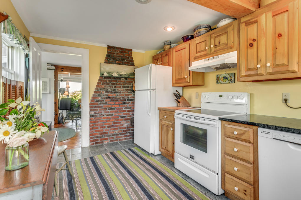 240 Robbins Hill Road Brewster, MA 02631 - Photo 16 of 35 a kitchen with a refrigerator and a stove