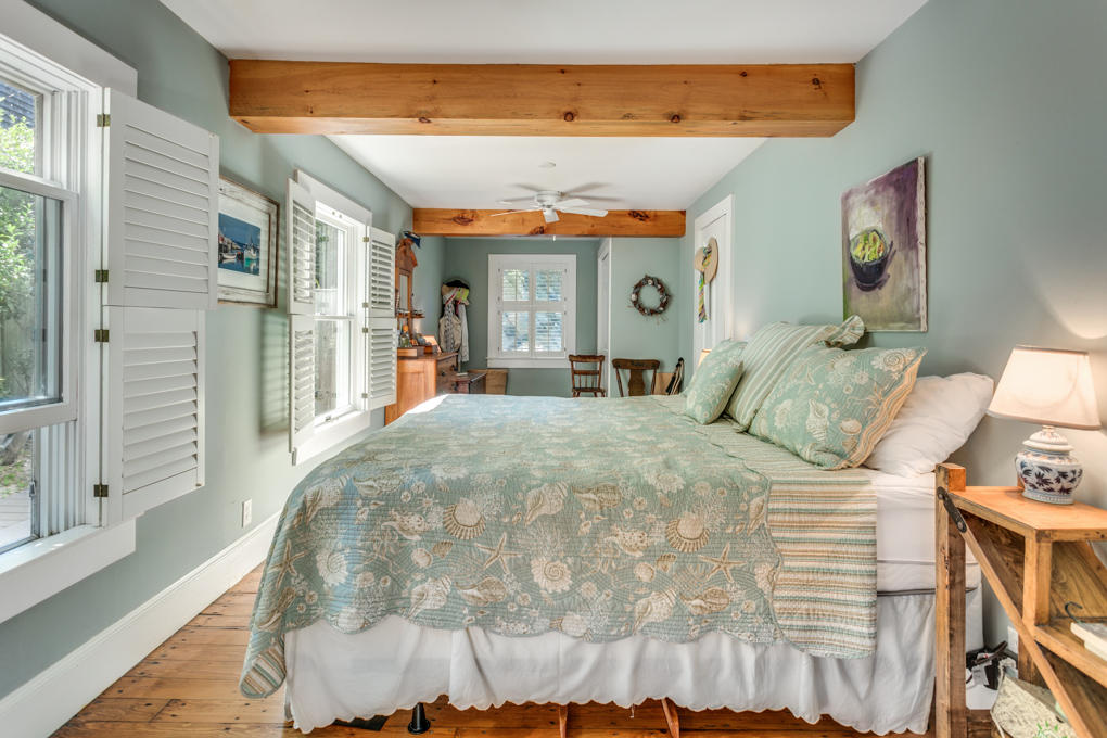 240 Robbins Hill Road Brewster, MA 02631 - Photo 19 of 35 a bedroom with a bed and a large window