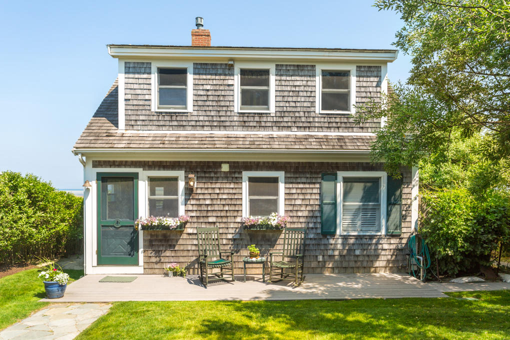 240 Robbins Hill Road Brewster, MA 02631 - Photo 2 of 35 a front view of a house with a yard