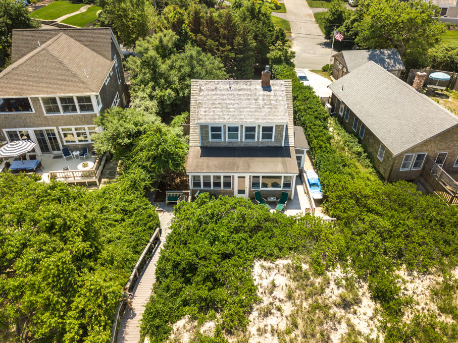 240 Robbins Hill Road Brewster, MA 02631 - Photo 4 of 35 aerial view of a house with a yard and potted plants