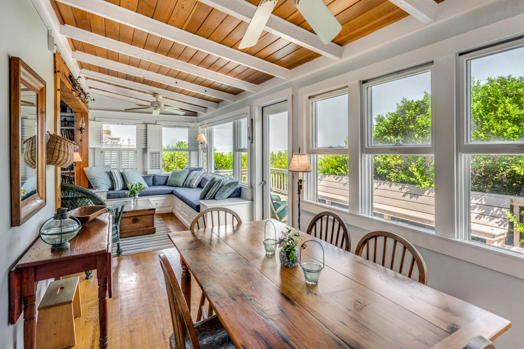 240 Robbins Hill Road Brewster, MA 02631 - Photo 9 of 35 a view of a dining room with furniture a chandelier and wooden floor