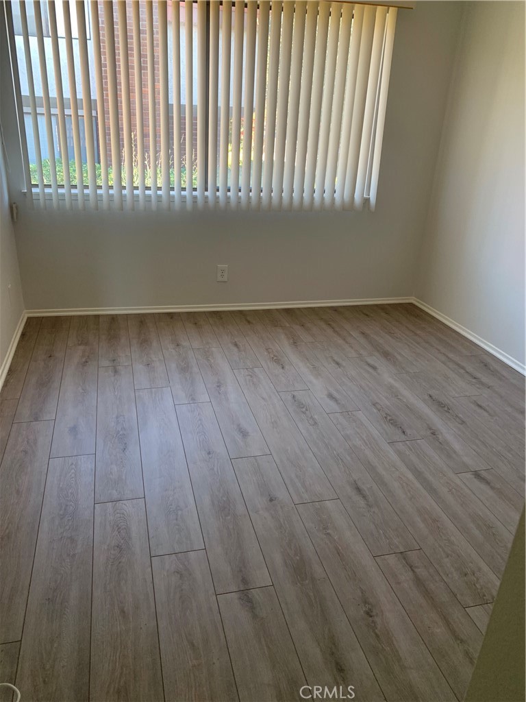 28000 Ridgebluff Court Rancho Palos Verdes, CA 90275 - Photo 16 of 33 an empty room with wooden floor and windows